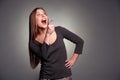 Amazed woman laughing and pointing up Royalty Free Stock Photo