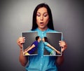 Amazed woman looking at disrupt photo