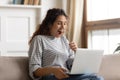 Amazed woman with open mouth looking at laptop screen Royalty Free Stock Photo