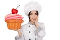 Amazed Woman Pastry Chef Holding Huge Cupcake Royalty Free Stock Photo