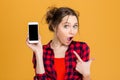 Amazed woman showing blank smartphone screen Royalty Free Stock Photo