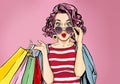 Amazed Young Woman In Glasses With Shopping Bags In Comic Style.