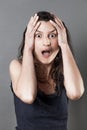 Amazed young woman expressing consternation and fear Royalty Free Stock Photo