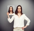 Amazed young woman hiding her emotions Royalty Free Stock Photo