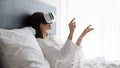 Amazed young woman try VR glasses in bedroom Royalty Free Stock Photo