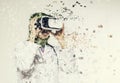 Amazed young women wearing virtual reality goggles dispersing into pixels effect Royalty Free Stock Photo