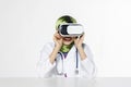 Amazed young women wearing virtual reality goggles over abstract Royalty Free Stock Photo