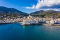 Amazing aerial panorama photo of Cadaques small cizy city by the sea in Spain. Sunny day and big clouds. Mountains