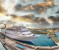 Amazing aerial view of cruise ship docked in a caribbean port at sunset. Vacation and relax concept Royalty Free Stock Photo