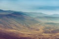 Amazing aerial view of desert, stone hills, and distant mountains layers range.Wilderness background. Near Mount Erciyes. Kayseri, Royalty Free Stock Photo