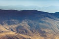 Amazing aerial view of desert, stone hills, and distant mountains layers range.Wilderness background. Near Mount Erciyes. Kayseri, Royalty Free Stock Photo