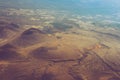 Amazing aerial view of desert, stone hills, and distant mountains layers range.Wilderness background. Near Mount Erciyes. Kayseri, Royalty Free Stock Photo