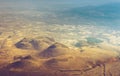 Amazing aerial view of desert, stone hills, and distant mountains layers range.Wilderness background. Near Mount Erciyes. Kayseri, Royalty Free Stock Photo