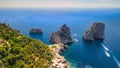 Amazing aerial view of Faraglioni Rocks over the sea in Capri Island, Italy. Drone viewpoint Royalty Free Stock Photo