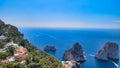 Amazing aerial view of Faraglioni Rocks over the sea in Capri Island, Italy. Drone viewpoint Royalty Free Stock Photo