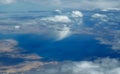 Amazing aerial view view fluffy clouds above Sinai, Sharm El Sheikh, bright blue sea and sand islands in the Red sea Royalty Free Stock Photo