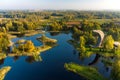 Amazing aerial view of Kirkilai karst lakes and lookout tower in the bright sunny autumn morning, Birzai, Lithuania