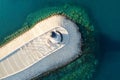 Amazing aerial view of lighthouse and dam on Lustica bay near Tivat, Montenegro on sunny day