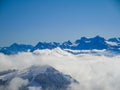 Amazing aerial view of misty swiss alps and clouds above the mountain peaks from mount rigi Royalty Free Stock Photo