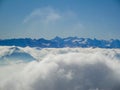 Amazing aerial view of misty swiss alps and clouds above the mountain peaks from mount rigi Royalty Free Stock Photo