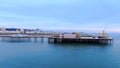 Amazing aerial view over Brighton Pier and Beach in England - drone footage Royalty Free Stock Photo