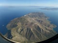 Amazing aerial view of Santorini island as seen from plane window before landing Royalty Free Stock Photo