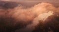 Amazing aerial view on sunrise. foggy river and golden  trees. beautiful autumn landscape. drone shot, bird`s eye Royalty Free Stock Photo