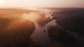 Amazing aerial view on sunrise. foggy river and golden  trees. beautiful autumn landscape. drone shot, bird`s eye Royalty Free Stock Photo