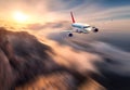 Amazing airplane mith motion blur effect is flying over low clouds Royalty Free Stock Photo