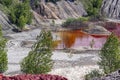 Amazing apocalyptic landscape like a planet Mars surface. Solidified red-brown black Earth surface. Barren, cracked and scorched