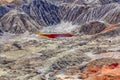 Amazing apocalyptic landscape like a planet Mars surface. Solidified red-brown black Earth surface. Barren, cracked and scorched