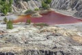 Amazing apocalyptic landscape like a planet Mars surface. Solidified red-brown black Earth surface. Barren, cracked and scorched