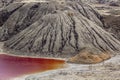 Amazing apocalyptic landscape like a planet Mars surface. Solidified red-brown black Earth surface. Barren, cracked and scorched