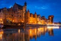 Amazing architecture of Gdansk old town at night with a new footbridge over the Motlawa River. Poland Royalty Free Stock Photo