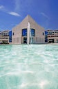 Amazing architecture of modern building next to pond with fountain Royalty Free Stock Photo