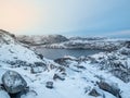 Amazing Arctic landscape with a high-altitude frozen lake. Arctic tundra background. Pure wild nature concept Royalty Free Stock Photo