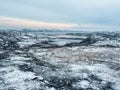 Amazing Arctic landscape with a high-altitude frozen lake. Arctic tundra background. Snow valley with rocks and hills. Pure wild Royalty Free Stock Photo