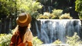 Amazing Asia journey. Happy travel woman admired and inspiring her vacation and adventure on famous waterfall in