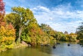 Amazing autumn colors of Central Park with lake reflections, New Royalty Free Stock Photo