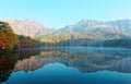 Amazing autumn lake scenery of Kagami Ike Mirror Pond in morning light with symmetric reflections of colorful fall foliage Royalty Free Stock Photo