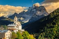 Amazing autumn landscape with church on the hill, Dolomites, Italy