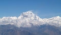 Amazing autumn panorama with mountains covered with snow and forest against the background of blue sky and clouds. Mount Everest, Royalty Free Stock Photo