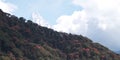 Amazing autumn panorama with mountains covered with snow and forest against the background of blue sky and clouds. Mount Everest, Royalty Free Stock Photo