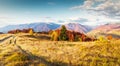 An amazing autumn panorama with a picturesque sky. Colorful autumn sunset in the Carpathians, Ukraine, Europe. Royalty Free Stock Photo