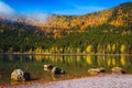 Amazing autumn scenery with Saint Ana lake and colorful forest Royalty Free Stock Photo