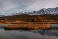 Mountains lake island sunset reflection trees autumn Royalty Free Stock Photo