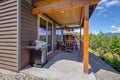 Amazing balcony patio with fire pit and forest and mountains view. Dream come true home exterior. New AMerican architecture. Royalty Free Stock Photo