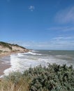 Amazing beach with clear skies and cliff sides.