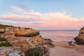 Amazing beach at sunrise. Algarve is located in the south of Portugal and is a vacation destination for many tourists. Your stone Royalty Free Stock Photo