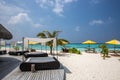 Amazing beach, yellow beach umbrella, blue sky, concept of paradise, perfect gateway vacation. Royalty Free Stock Photo